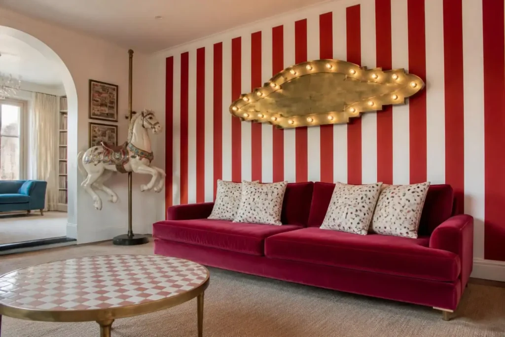 Funhaus House Names the candy-stripe porch with carousel horse